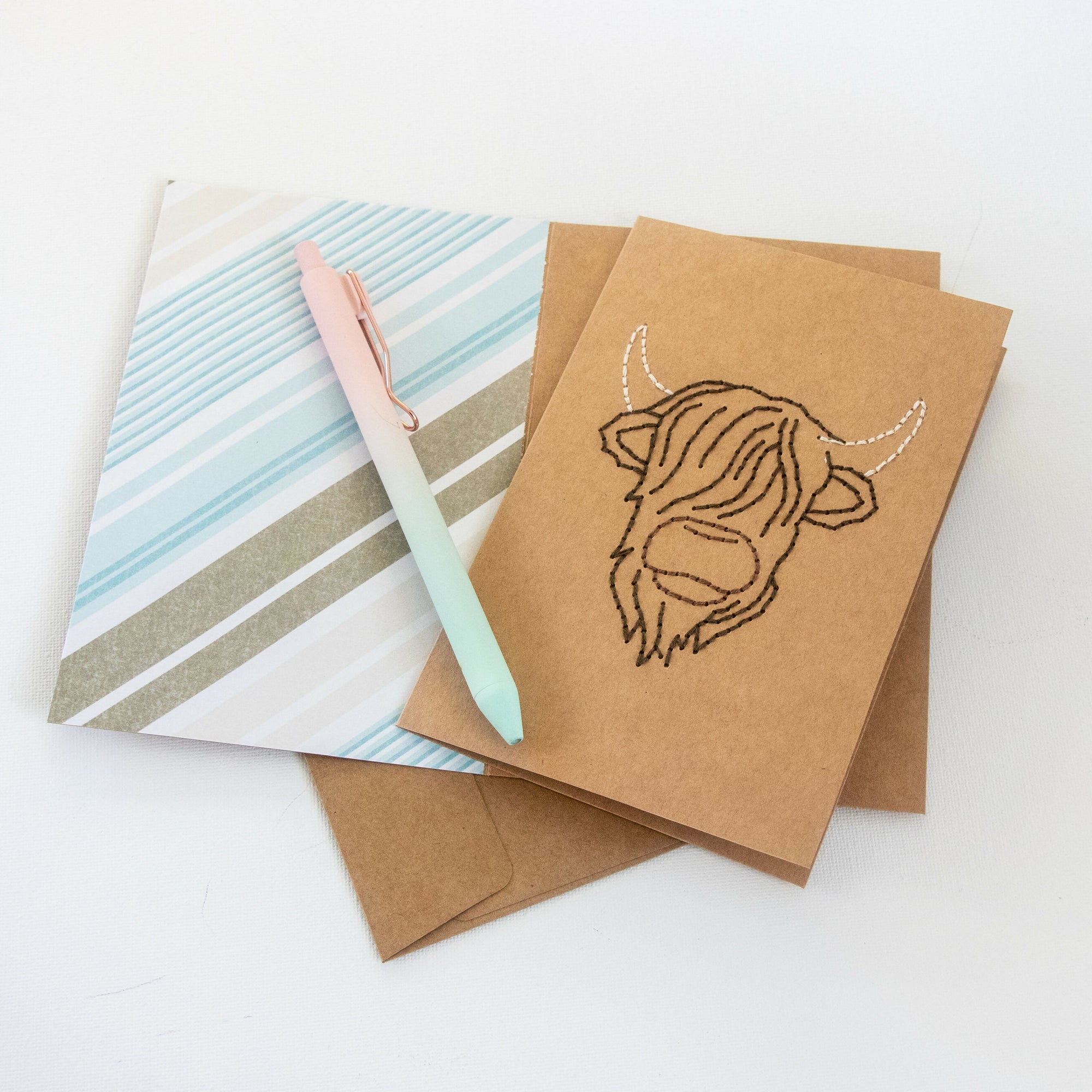 Highland Cow Greeting Card with open card and pen