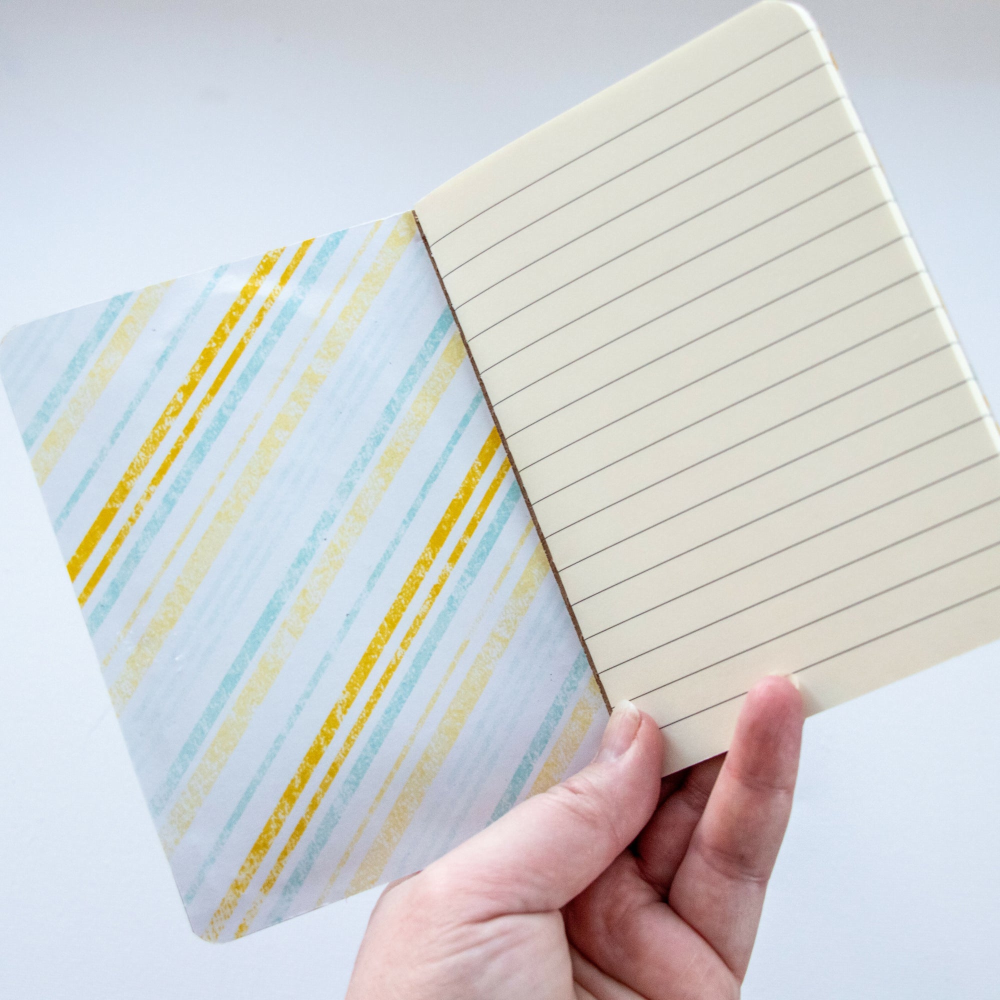 Yellow Stripe Front Cover in Hand