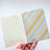 Yellow Stripe Back Cover in Hand