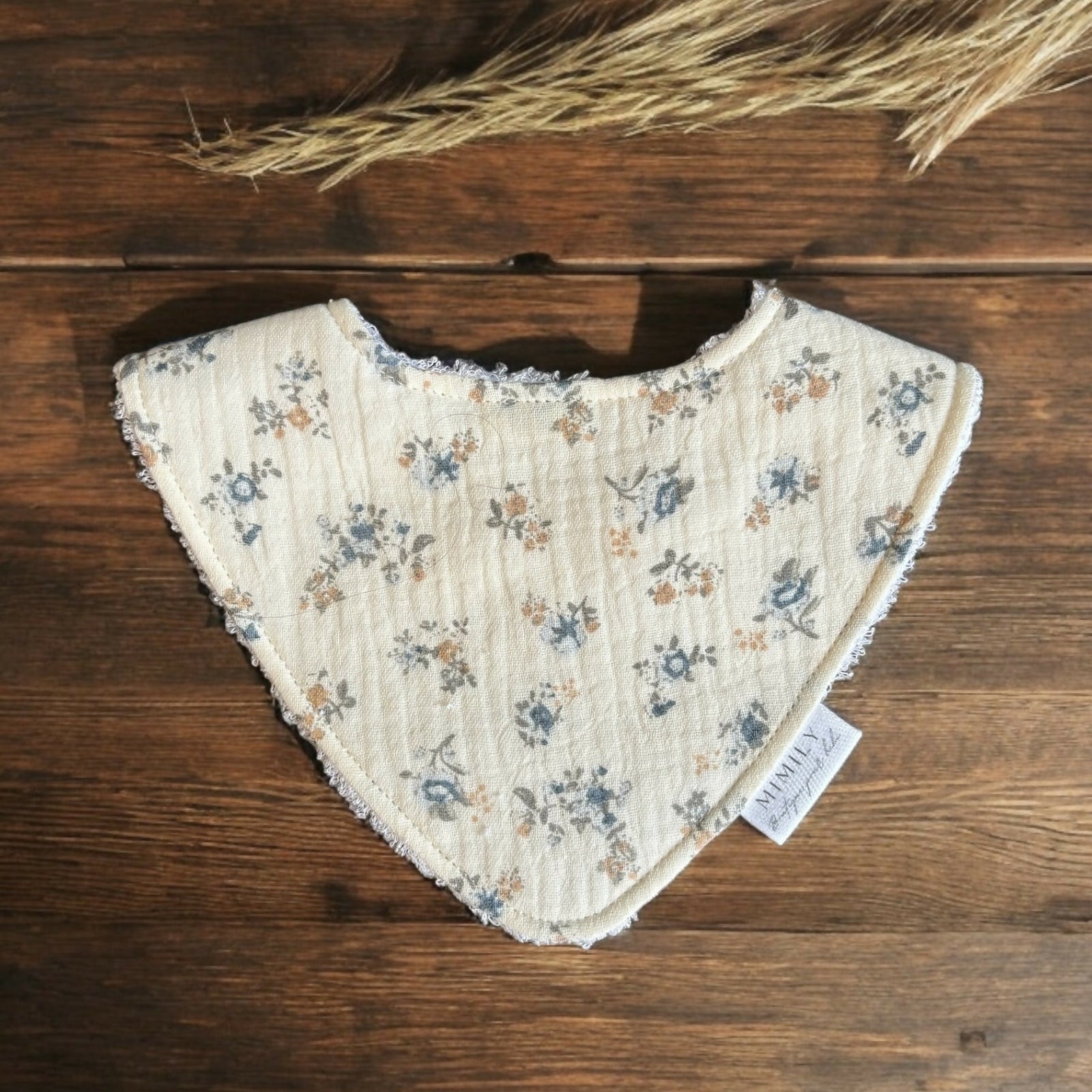 Mimily Boutique | Off white bib with blue and pink flowers