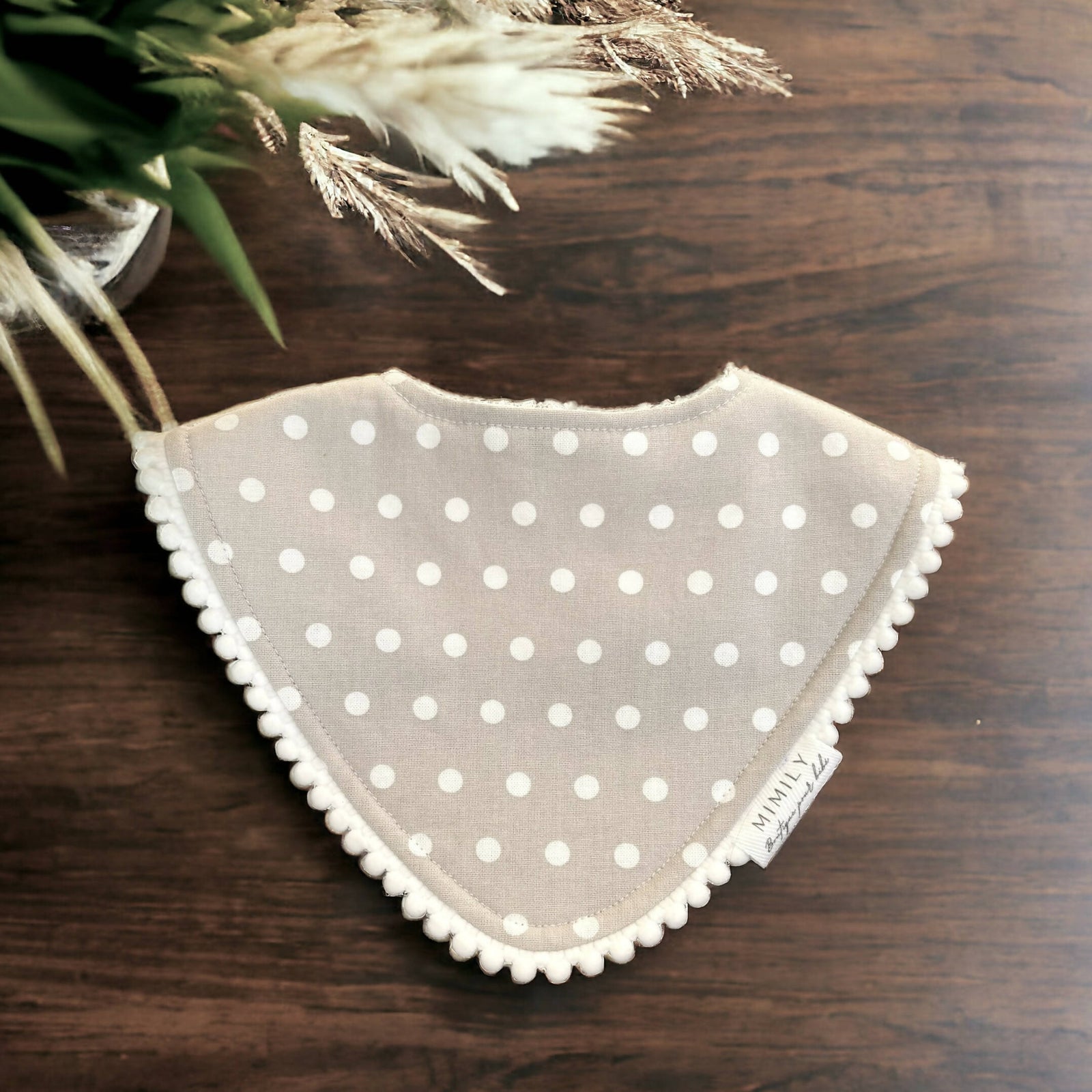 Mimily Boutique | Polka dot bib with pompoms